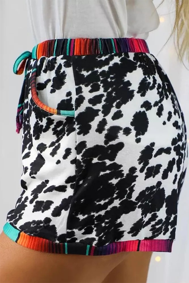 Pantalones rectos de cintura media con estampado completo y parches de leopardo a la moda