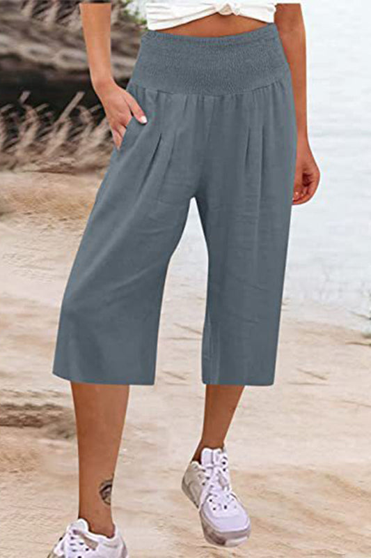 Pantalones casuales sencillos de color liso con bolsillos, sueltos, de cintura alta y pierna ancha.