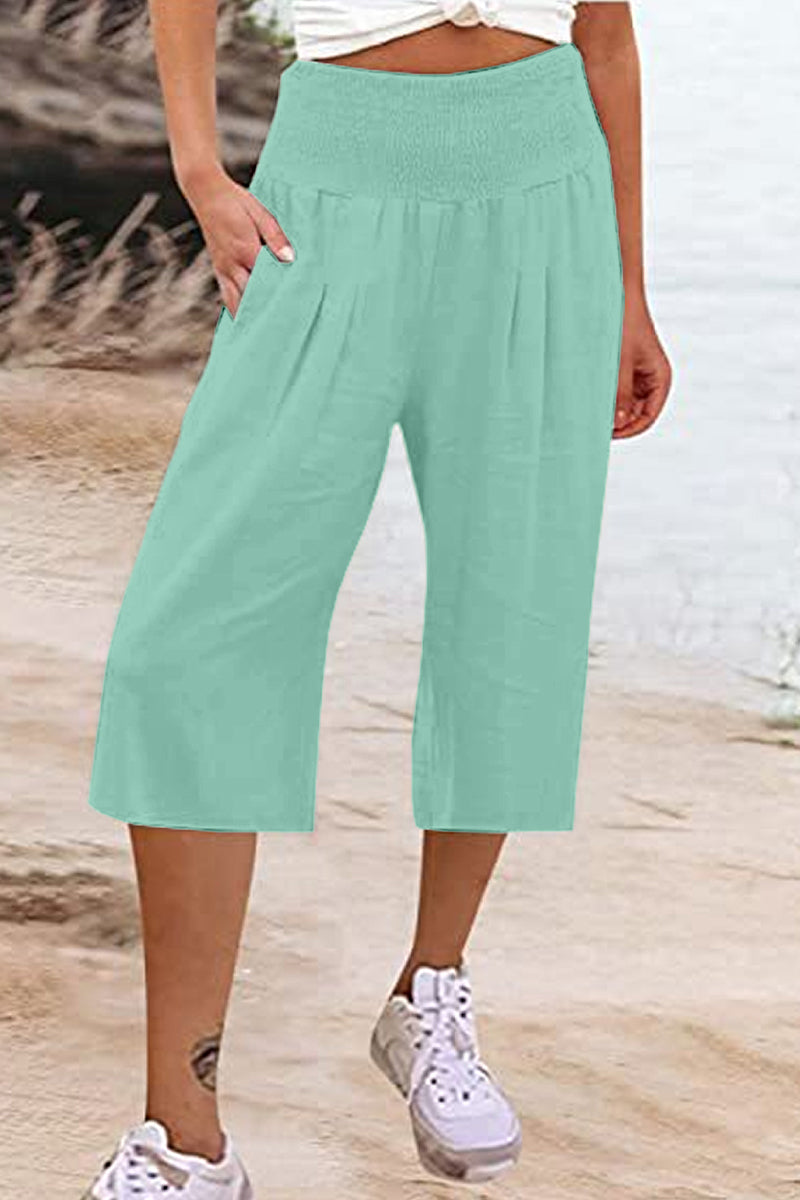 Pantalones casuales sencillos de color liso con bolsillos, sueltos, de cintura alta y pierna ancha.