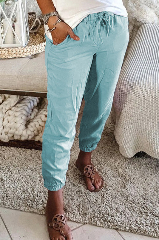 Pantalones casuales de color liso con bolsillos y cintura media regular