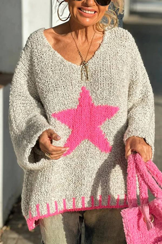 Suéter holgado con textura de punto y estampado de estrellas en color contrastante para un cálido día de invierno