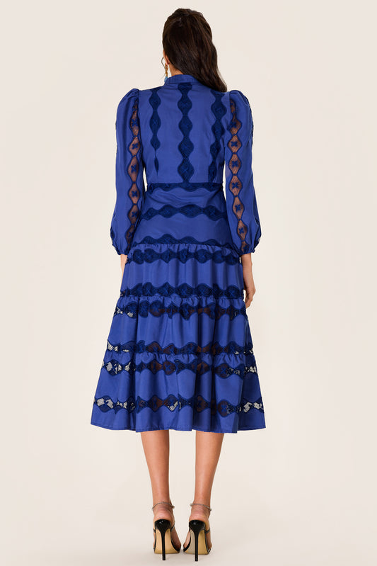 Vestido midi con bajo liso bordado