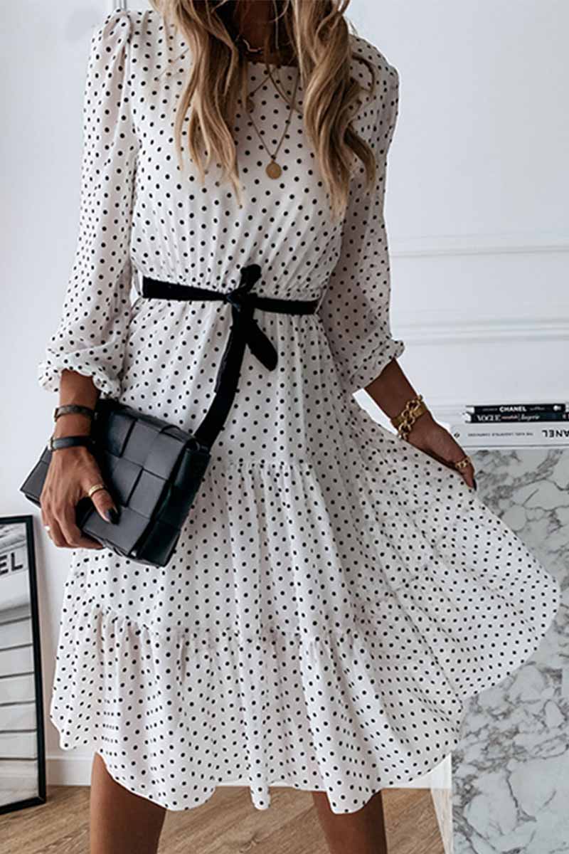 Elegante vestido midi con cuello redondo y lazo y estampado de lunares