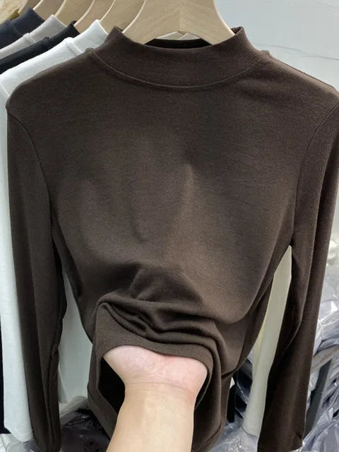 Camiseta básica blanca de algodón puro de alta calidad para mujer, elegante top ajustado de cuello alto y manga larga.