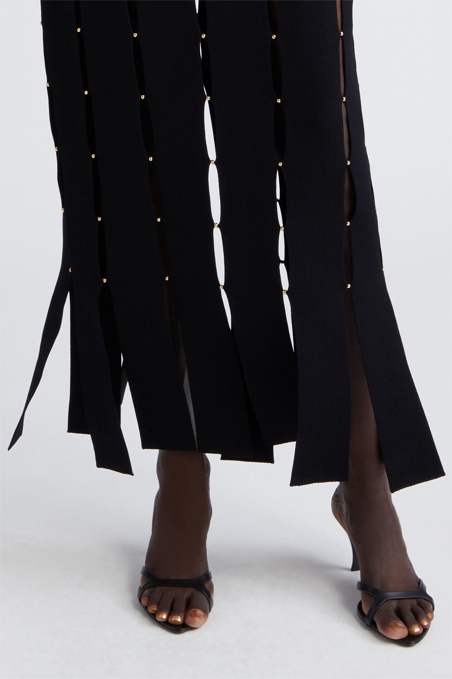 Vestido midi sin mangas de punto liso con cortes