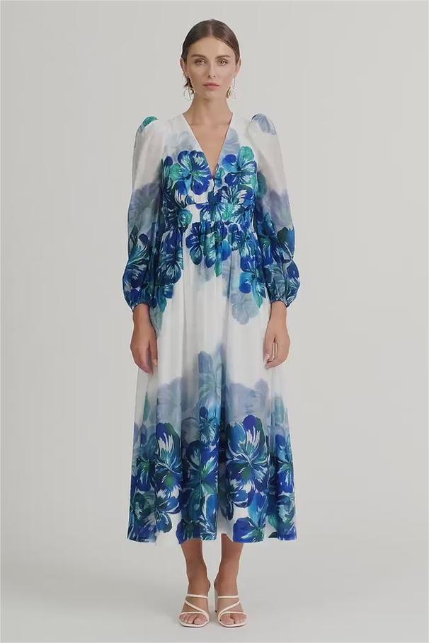 Vestido midi floral con cuello en V y mangas farol