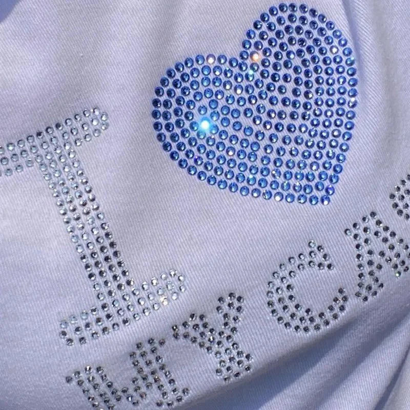 Camiseta de manga corta de verano estilo europeo y americano con parte superior de diamante caliente con letras, camiseta con interior ajustado para mujer