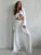 Conjunto informal de dos piezas para mujer, con cuello en V, manga larga con cordones y pantalones de cintura alta.