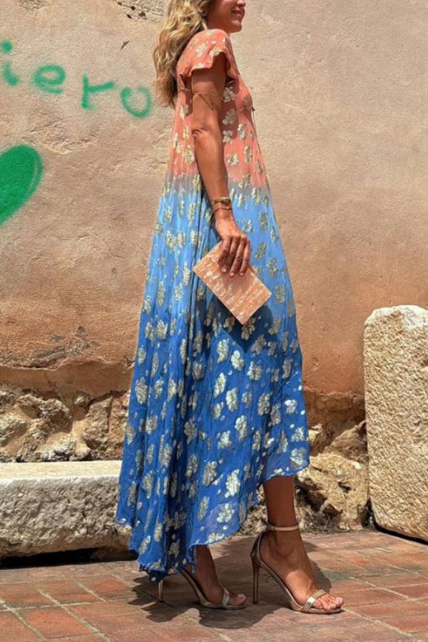 Vestido largo Evaluna con estampado de flores doradas en degradado tie-dye y manga corta
