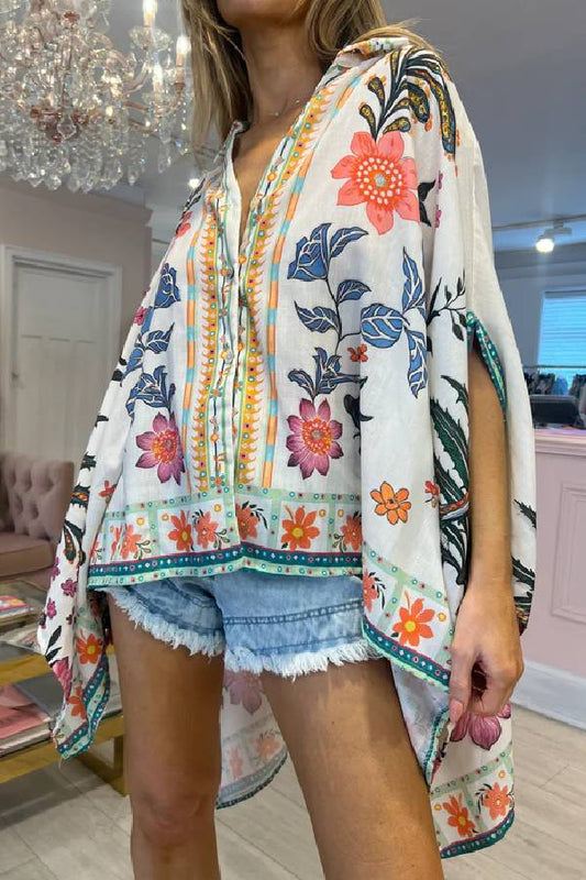 CAMISA OVERSIZE CON ESTAMPADO FLORAL ROSA