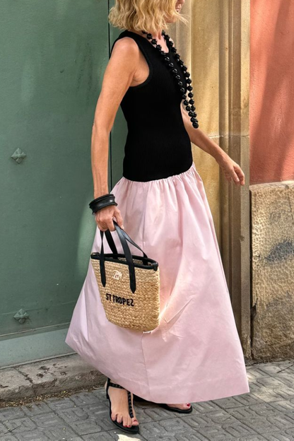 Vestido largo de punto negro sin mangas con dobladillo suelto rosa