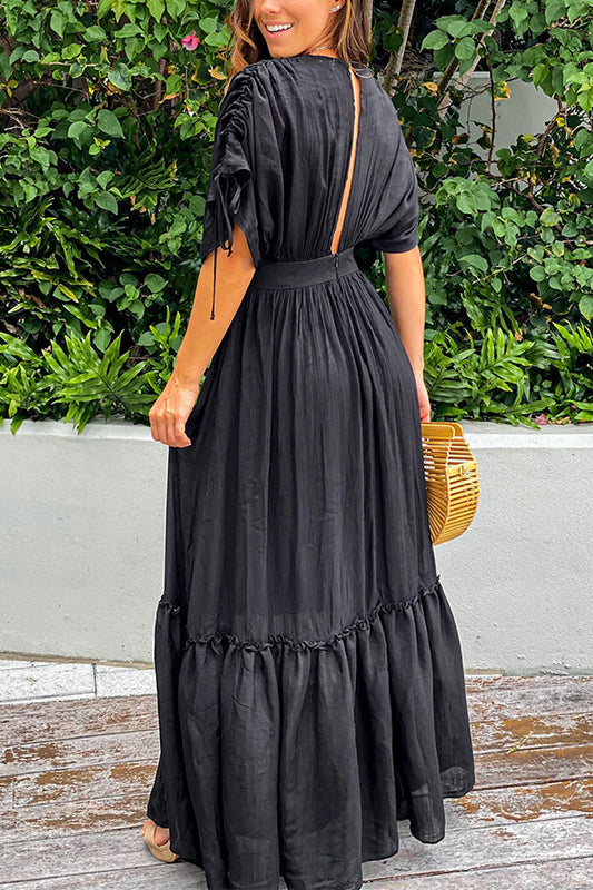 Vestido largo negro con volantes, mangas kimono, plisado y cordón ajustable