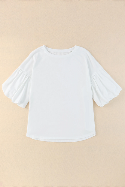 Blusa informal de color blanco liso con mangas abullonadas