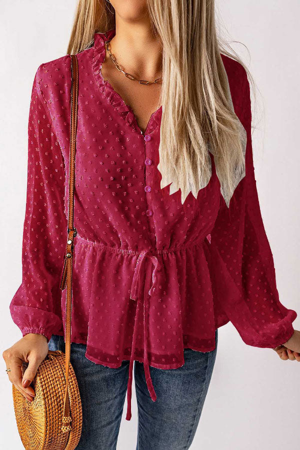 Elegante blusa de lunares con cuello en V, botones y cintura anudada