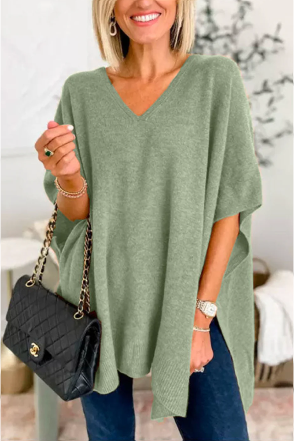 Suéter tipo poncho holgado de color liso con cuello en V