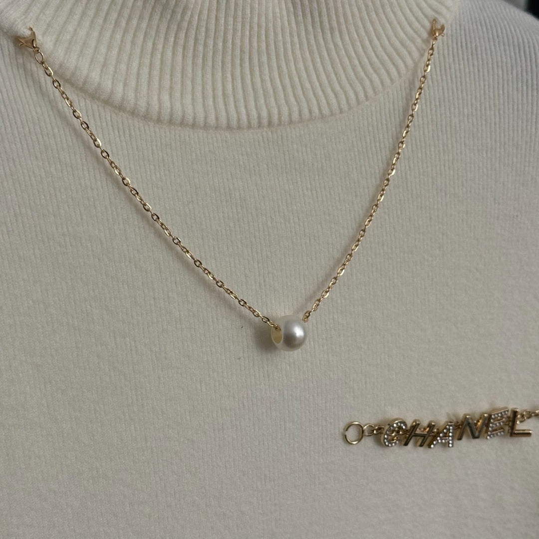 Chanel Metal Logo Lettering Pearl Gold Necklace Tassel Long-Sleeve Knit Top