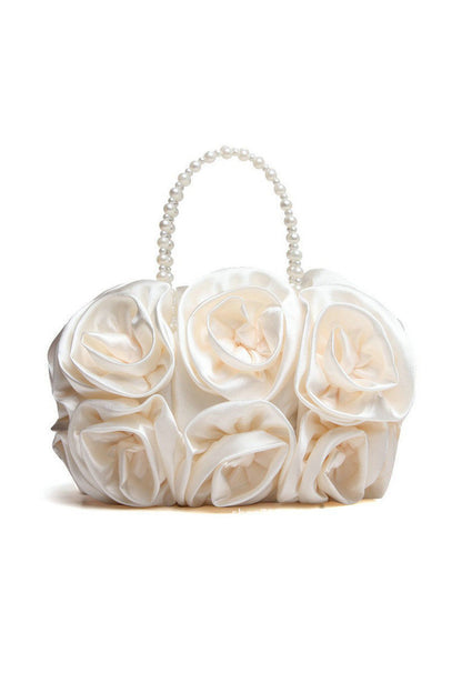 Bolso de mano con rosetas de satén y perlas 