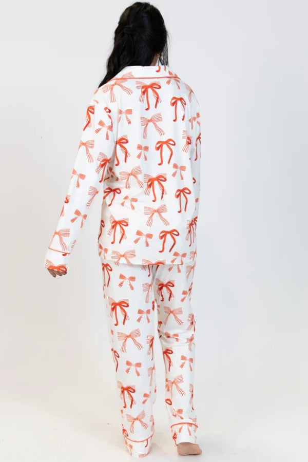 Conjunto de camisa de manga larga con estampado de lazo navideño y pantalón con bolsillo en la cintura elástica
