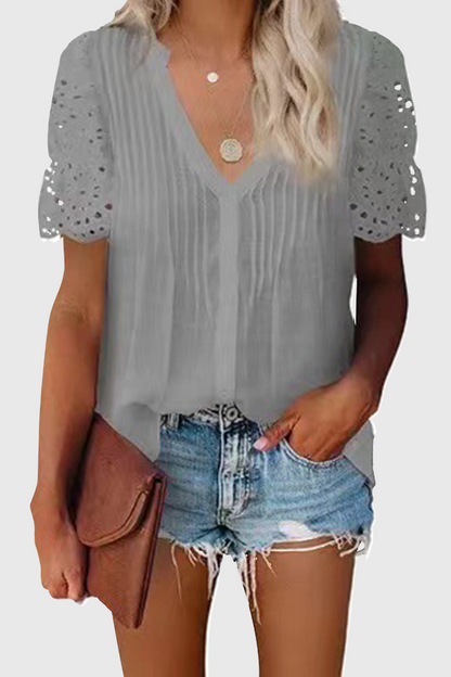 Elegante blusa de cuello en V con patchwork ahuecado y liso