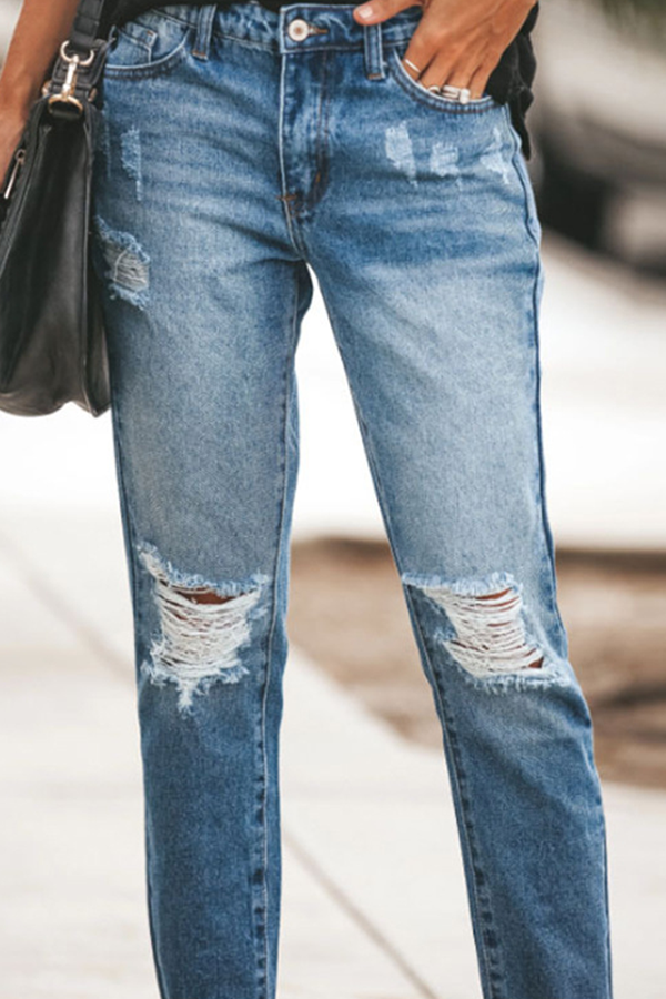 Pantalones rotos con borlas lisas de calle