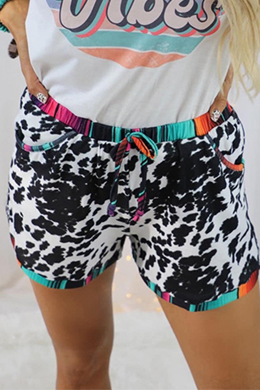 Pantalones casuales de cintura media rectos con estampado completo y parches de leopardo