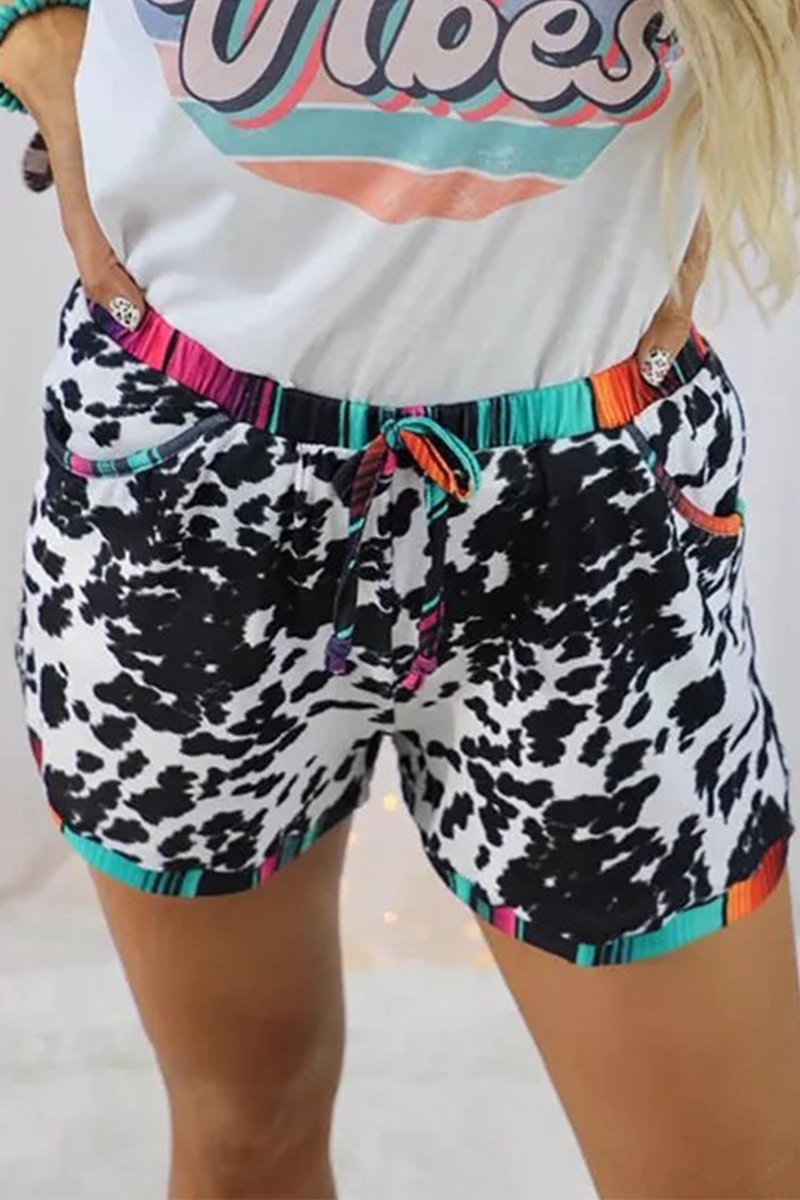 Pantalones rectos de cintura media con estampado completo y parches de leopardo a la moda