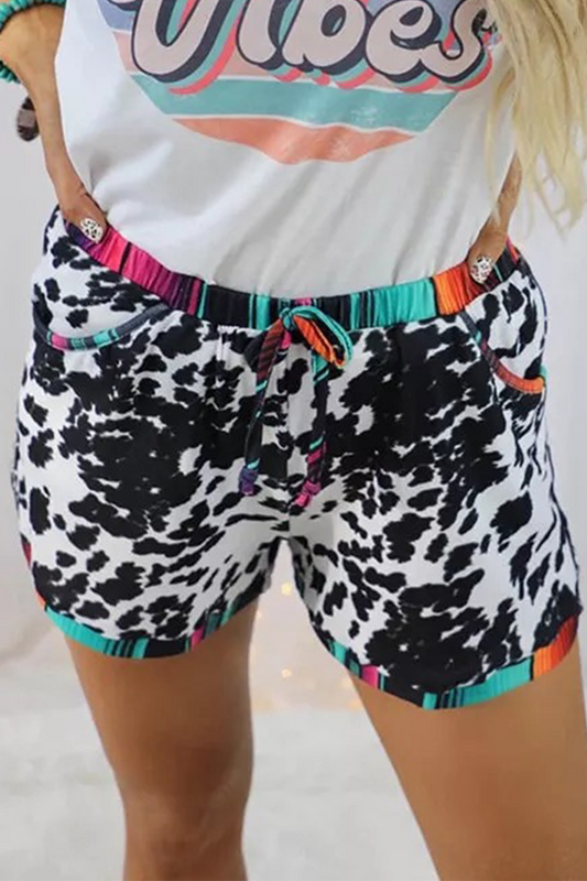 Pantalones rectos de cintura media con estampado completo y parches de leopardo a la moda