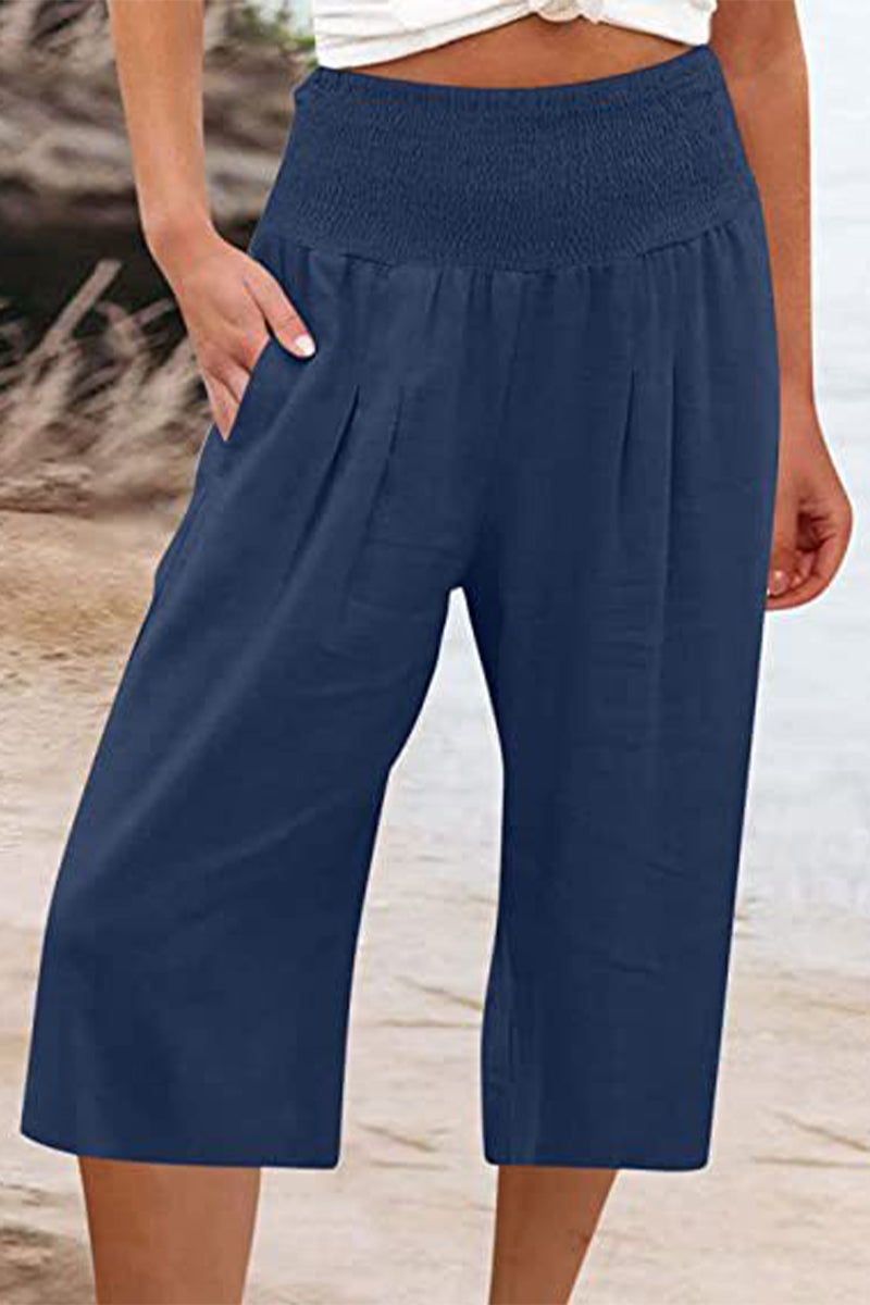 Pantalones casuales sencillos de color liso con bolsillos, sueltos, de cintura alta y pierna ancha.