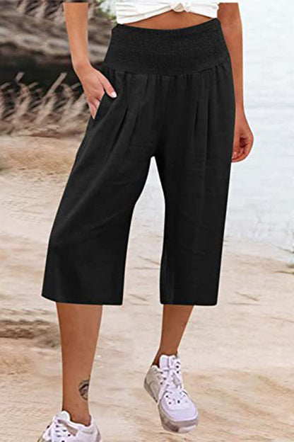 Pantalones casuales sencillos de color liso con bolsillos, sueltos, de cintura alta y pierna ancha.