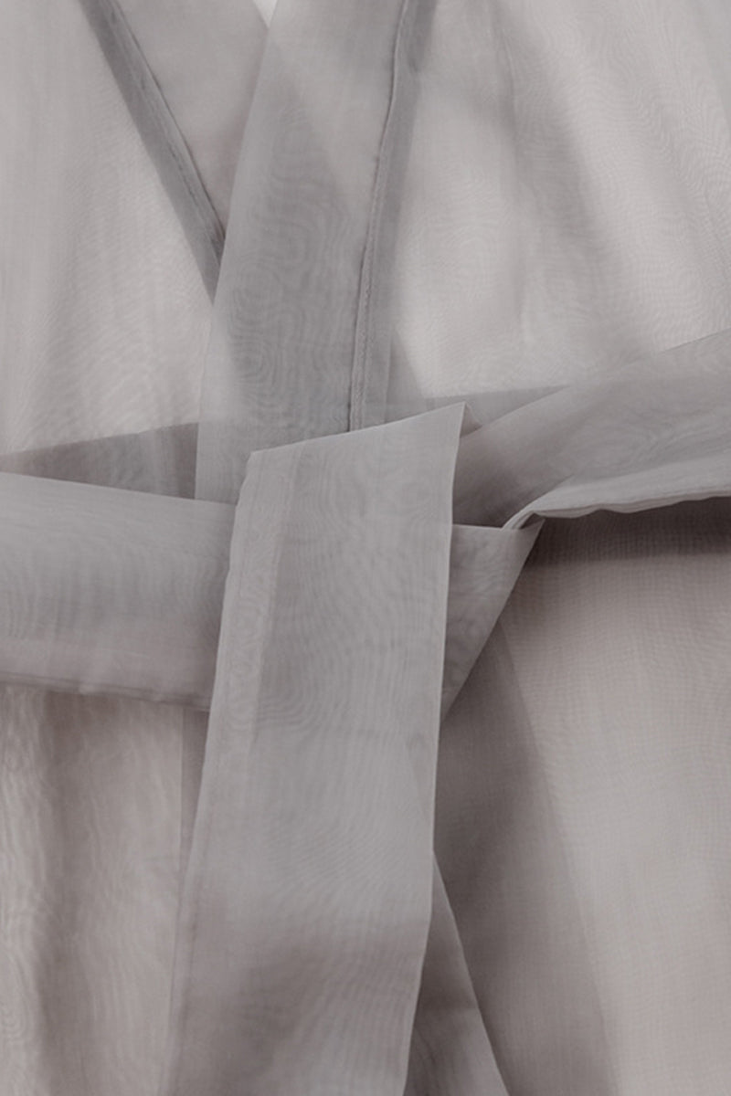 Elegantes blusas de escote en V transparente con frenillo liso