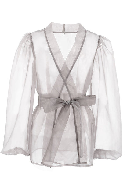 Elegantes blusas de escote en V transparente con frenillo liso
