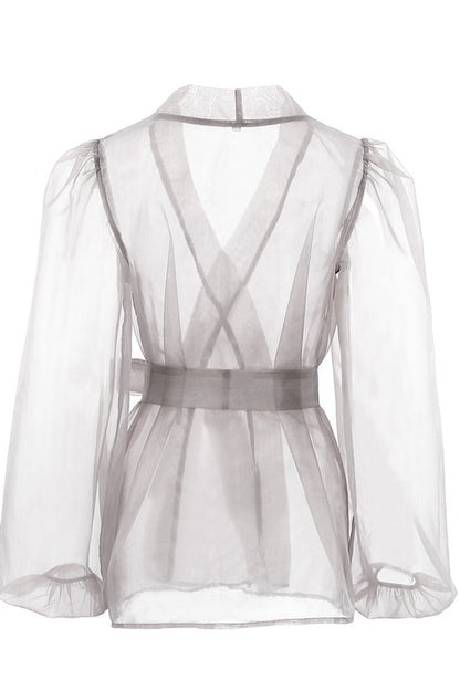 Elegantes blusas de escote en V transparente con frenillo liso