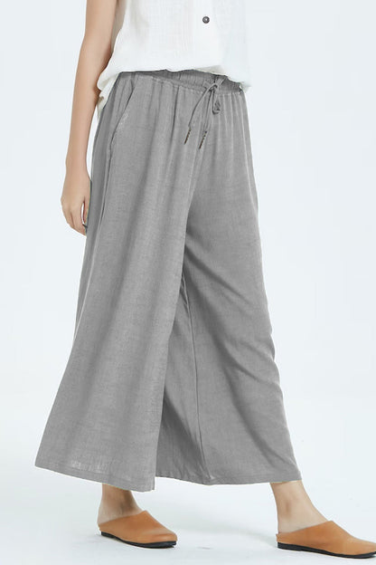 Pantalones casuales sencillos de color liso con cintura alta, pierna ancha y holgados.