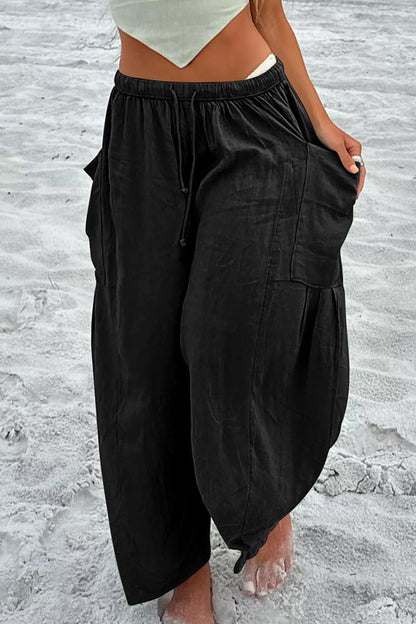 Pantalones casuales sencillos de color liso con bolsillos, holgados, de cintura media y pierna ancha.