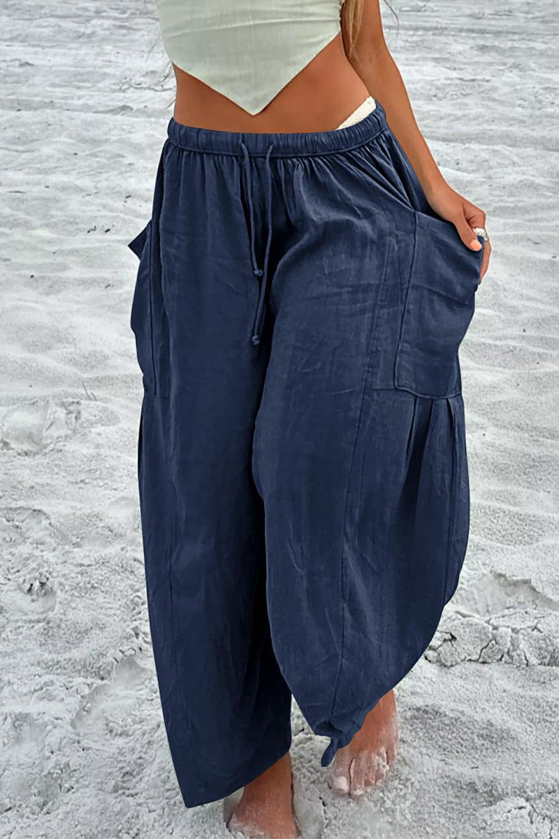Pantalones casuales sencillos de color liso con bolsillos, holgados, de cintura media y pierna ancha.