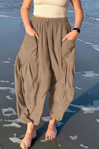 Pantalones casuales sencillos de color liso con bolsillos, holgados, de cintura media y pierna ancha.
