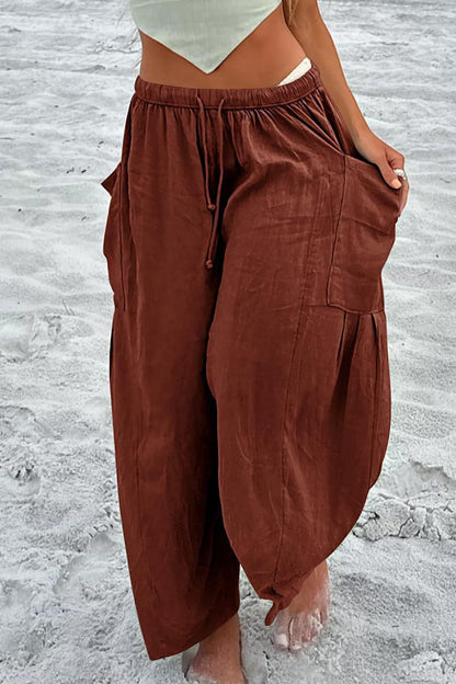 Pantalones casuales sencillos de color liso con bolsillos, holgados, de cintura media y pierna ancha.