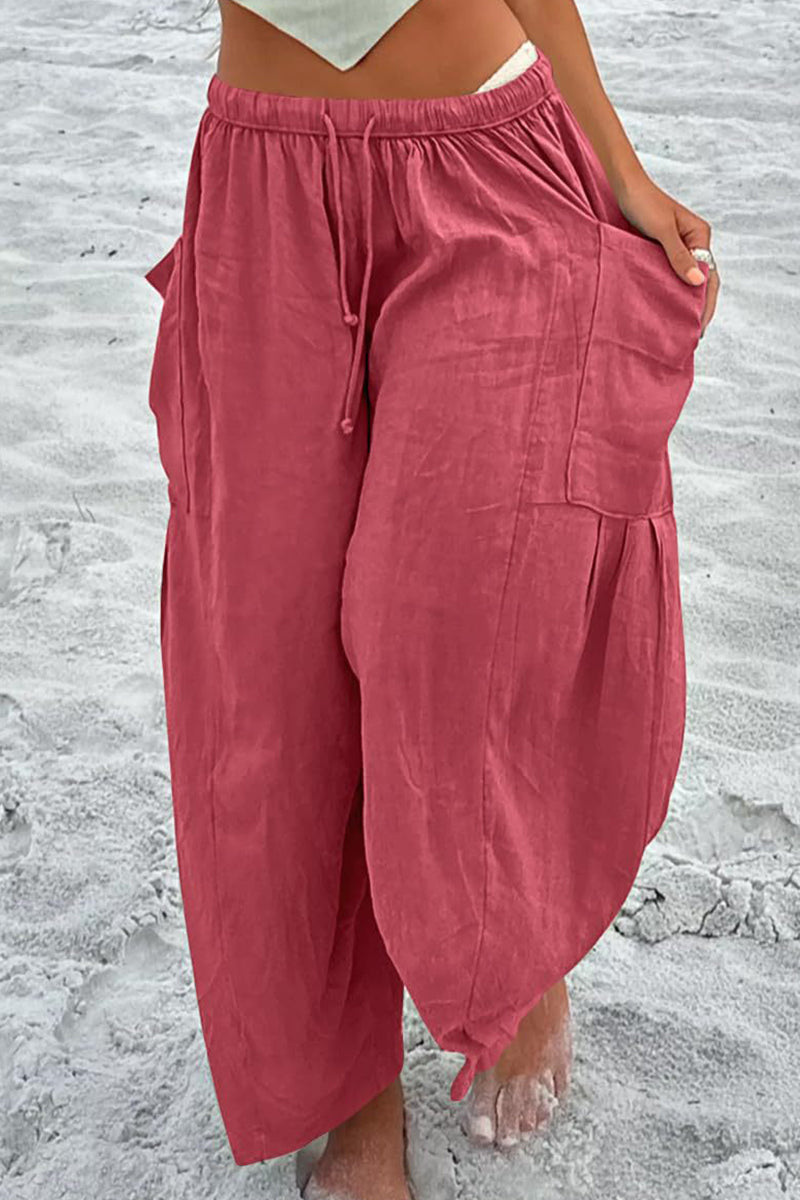 Pantalones casuales sencillos de color liso con bolsillos, holgados, de cintura media y pierna ancha.