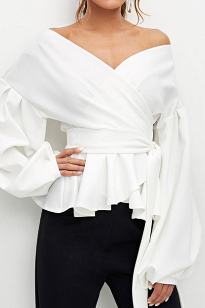 Elegante blusa lisa con escote en V y lazo