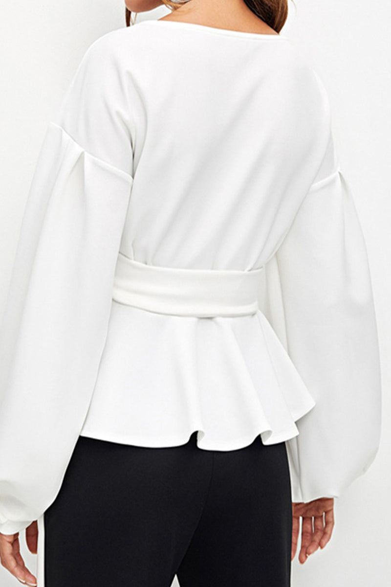 Elegante blusa lisa con escote en V y lazo
