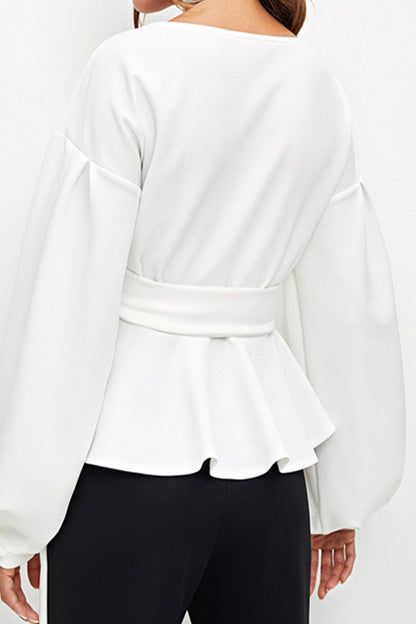 Elegante blusa lisa con escote en V y lazo