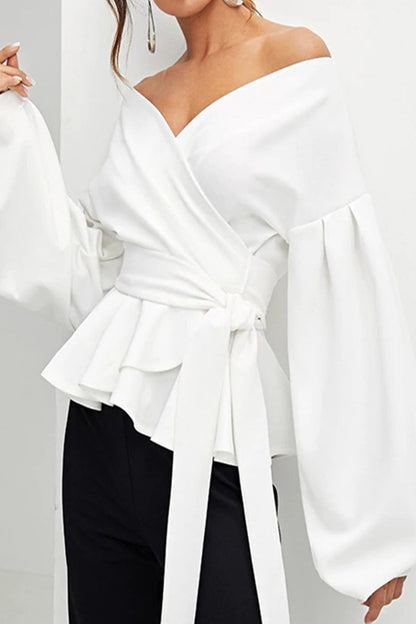 Elegante blusa lisa con escote en V y lazo
