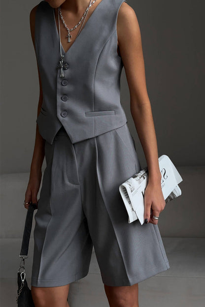 Conjunto de dos piezas elegante estilo británico con cuello en V, sin mangas, bolsillos sólidos y botones
