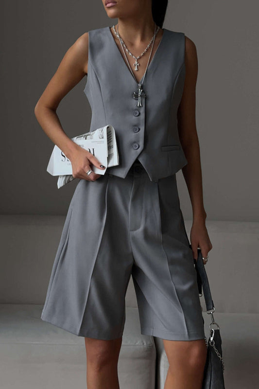 Conjunto de dos piezas elegante estilo británico con cuello en V, sin mangas, bolsillos sólidos y botones