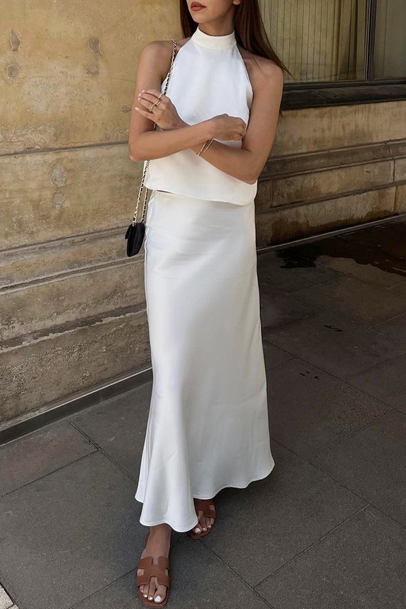Elegante traje de baño de dos piezas con cuello halter, sin mangas y estampado sólido