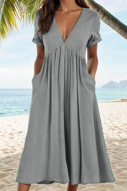 Vestidos casuales de corte A con cuello en V, bolsillos y pliegues sólidos