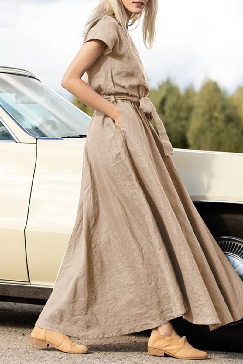 Vestidos elegantes de corte A con escote redondo, bolsillos y vendaje liso.