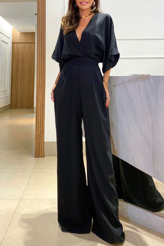 Mono elegante, holgado, liso, con frenillo, espalda descubierta y escote en V
