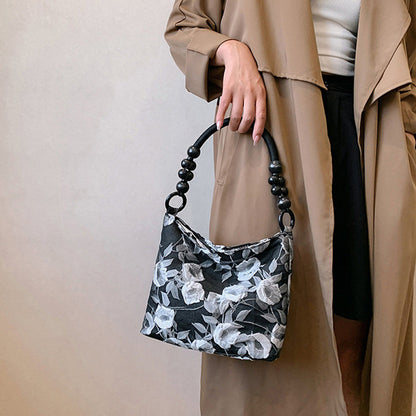Bolsos vintage elegantes con flores y cuentas plegables