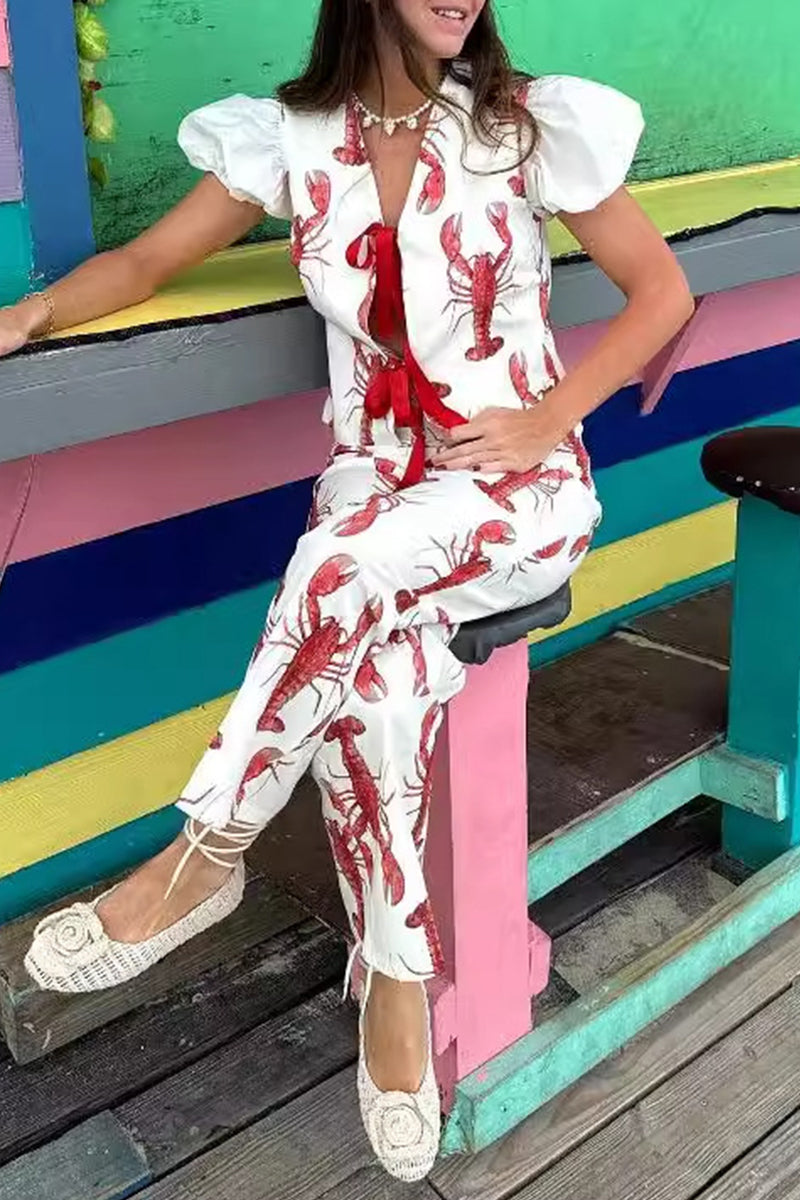 Conjunto de dos piezas con estampado animal, cuello en V, manga corta y lazo